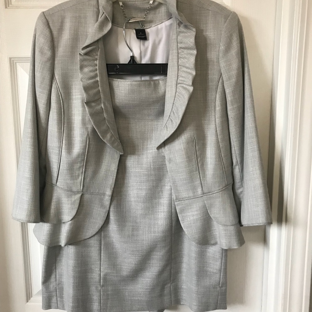 Pencil skirt and ruffled jacket.